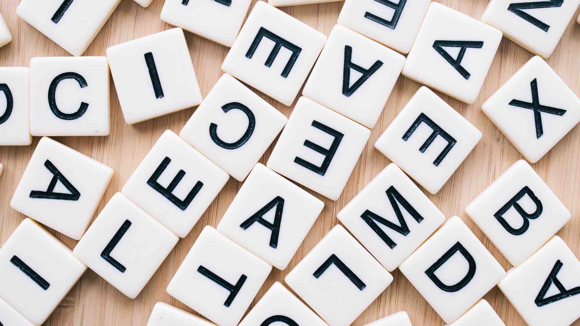 overhead shot of letter tiles as from a Scrabble game